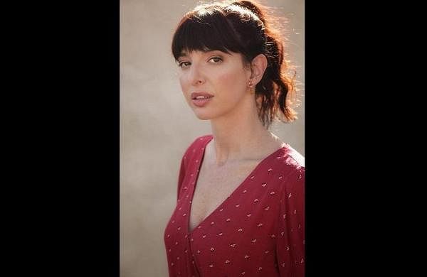 Photo of Lindsey Pearlman wearing a red top.